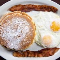 Pancake Combo · Served with 2 eggs and choice of bacon or sausage.