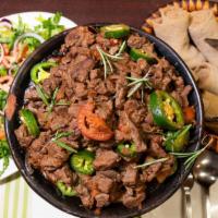 Regular Tibs · Cubed tender lamb or beef fried with onion, rosemary jalapeno pepper served with injera and ...