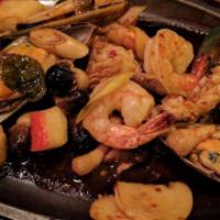 Seafood Sizzle · Pleasant mixture of shrimp, calamari, mussel, and crabmeat stir fried with roasted chili sau...