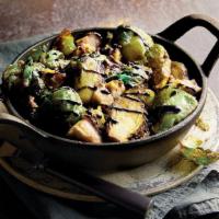 Crispy Brussels Sprouts · Fresh Brussels sprouts fried crisp, topped with a balsamic glaze and parmesan cheese. Served...