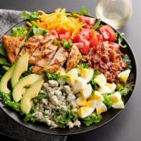 Chicken Cobb Salad · Grilled chicken, applewood bacon, mixed greens, cheddar cheese, bleu cheese crumbles, grape ...