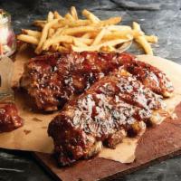 Slow-Roasted Baby-Back Ribs · Tender pork ribs basted with bourbon BBQ sauce. Served with fries and creamy coleslaw