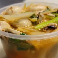 Tom Yum Chicken · Green onion, mushroom, cilantro, tomato and chili paste sour broth,bamboo.