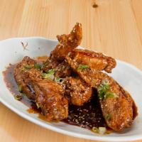 Korean Chicken Wings · Cooked wing of a chicken coated in sauce or seasoning.