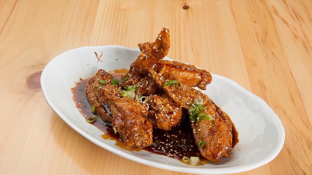 Korean Chicken Wings · Cooked wing of a chicken coated in sauce or seasoning.