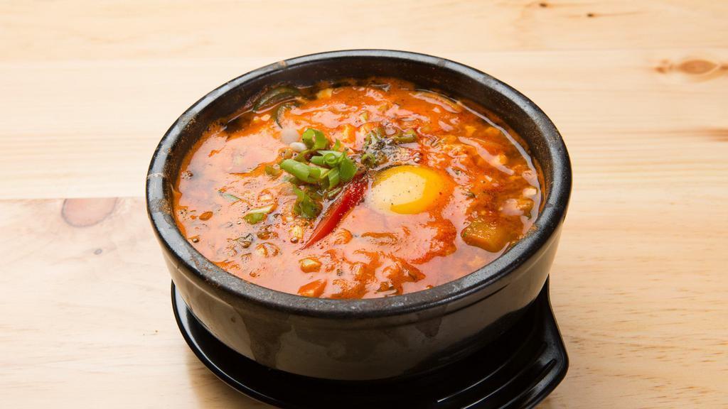 Sundubu Chigae · Spicy seafood, egg, soft tofu, and vegetable soup.
