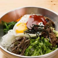 Bi Bim Bap · Assorted seasoned vegetables with choice of beef, chicken or tofu on a bed of rice with egg.