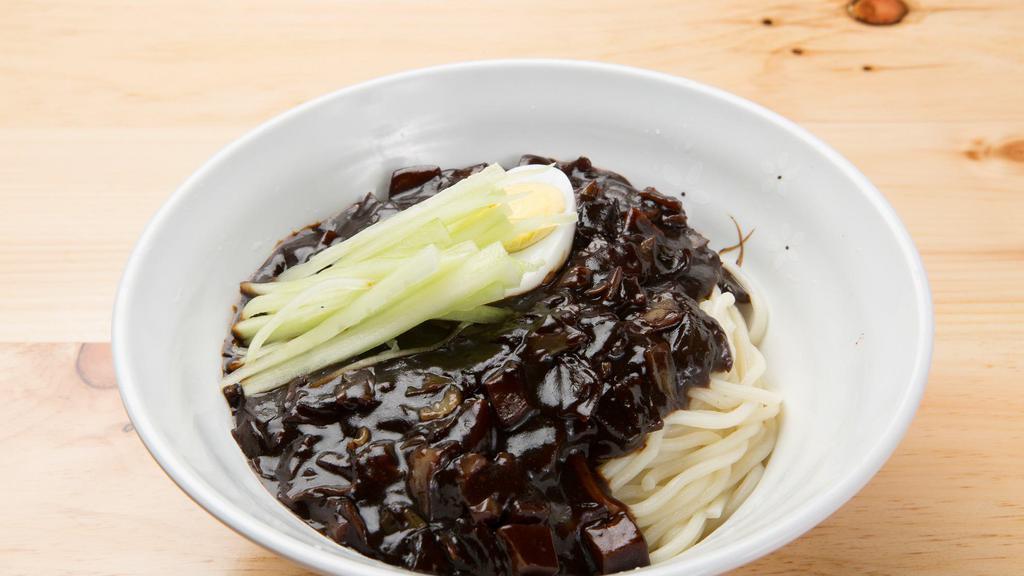 Ja Jang Myeon · Black bean sauce with pork and vegetables over white noodles, topped with a hard boiled egg.