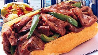 Italian Beef Sandwich · Thin sliced Italian Beef in Au Jus on a French bread with sweet or hot peppers.
