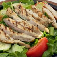 Grilled Chicken Salad · Tomatoes, cucumbers, and green peppers over romaine lettuce. Topped with strips of chicken a...