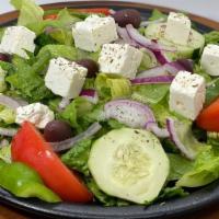 Greek Salad · Tomatoes, cucumbers, green peppers, feta cheese, and olives, over romaine lettuce and choice...