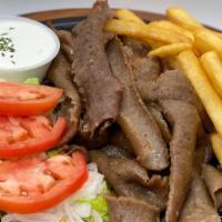 Gyros Plate · Freshly sliced Gyro meat with lettuce, onions, tomatoes, tzatziki sauce, pita, and fries.