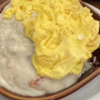 Country Skillet · Country steak, onion, tomato, cheese and sausage gravy on top.