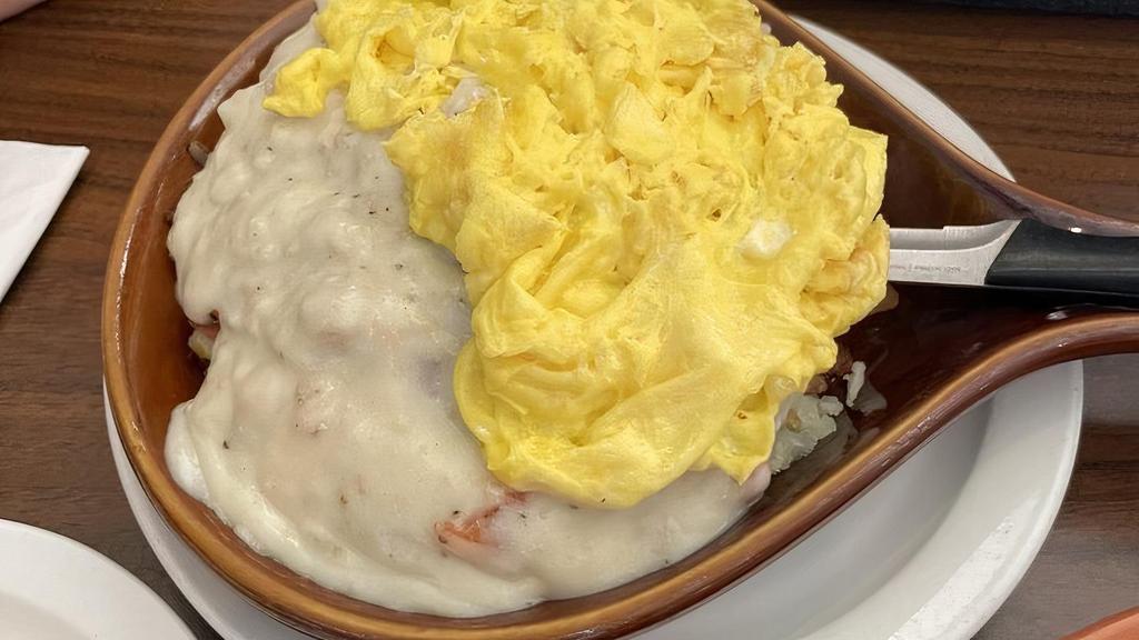 Country Skillet · Country steak, onion, tomato, cheese and sausage gravy on top.