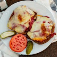 Reuben Sandwich · Thinly sliced corned beef on marble rye. open-faced with thousand island dressing, sauerkrau...