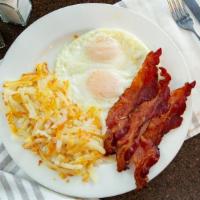 Two Eggs With Meat · Choice of Bacon, Sausage Links, Sausage Patties, or Canadian Bacon.