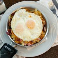 Piglet Skillet · Bacon, ham, sausage, cheese, onions, hashbrowns. Served with toast or pancakes.