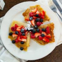 Berry Crepes · Three crepes, with strawberries, blueberries, or raspberries. Topped with powered sugar.
