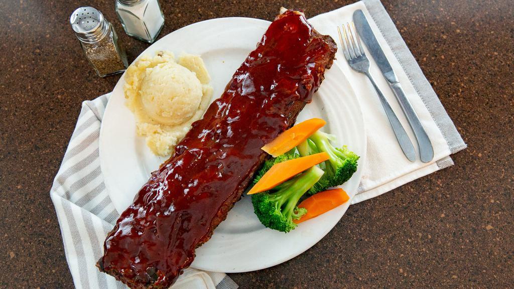 Barbecue Baby Back Ribs · Tender baby back ribs covered with our homemade bbq sauce.