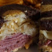 Reuben · Boar's Head corned beef with melted swiss, sauerkraut and 1000 island dressing on toast marb...