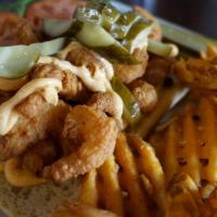 Shrimp Po' Boy Sandwich · crispy fried shrimp with lettuce, tomato and pickles with a chipotle mayo, served on toasted...