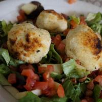Baked Goat Cheese · lightly breaded baked goat cheese on a bed of mixed greens with apples, pecans, and cherry t...