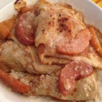 Peach Cobbler Crepes · warm cinnamon peach slices sauteed with grand marnier, folded inside of our delicious crepes...