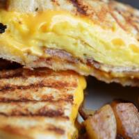 Full Breakfast Panini · scrambled eggs, grilled tomato, american cheese with choice of ham, bacon or sausage.