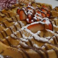 Strawberry Nutella Waffle · belgian waffle topped with fresh strawberries, drizzled with nutella.