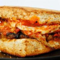 Hot Dago · Our house made Sauage patty loaded up with our house red sauce, sauteed onions, roasted red ...