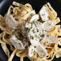 Chicken Fettuccine Alfredo · House Made Fettuccine Pasta with Alfredo Sauce and Four Cheese Blend. Topped with Grilled Ch...