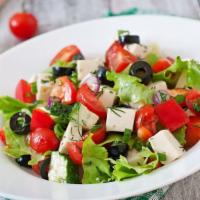 The Greek Salad · Fresh salad made with slices pepperoncini, shredded lettuce, sliced tomatoes, green peppers,...