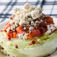 Loaded Wedge · With Bacon, Tomato , Crumbled Blue Cheese, and Blue Cheese dressing