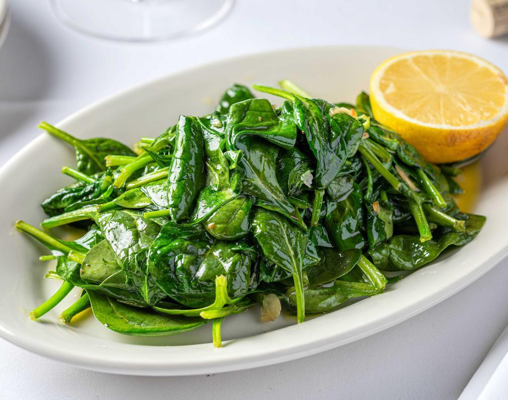 Sautéed Spinach · With Olive Oil & Garlic.