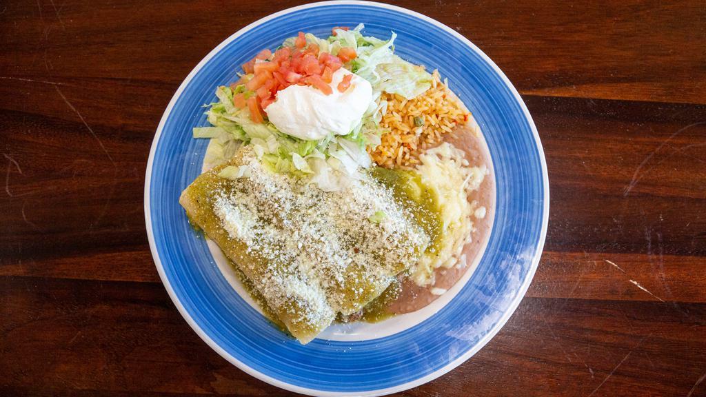 Enchiladas Verdes · Three enchiladas with your choice of chicken or beef topped with our delicious tomatillo sauce, Mexican sour cream and Mexican cheese. Served with rice and beans, just delicious.