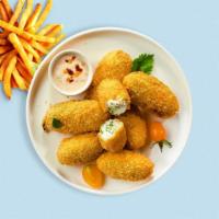 Jalapeño Poppers · Vegetarian. Fresh jalapeños coated in cream cheese and fried until golden brown.