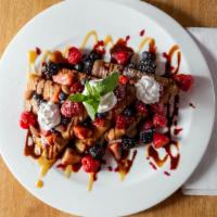 Crepes · 3 Crepes, Choice of Nutella, Banana & Berries, Caramel Banana or S'mores all topped with Whi...