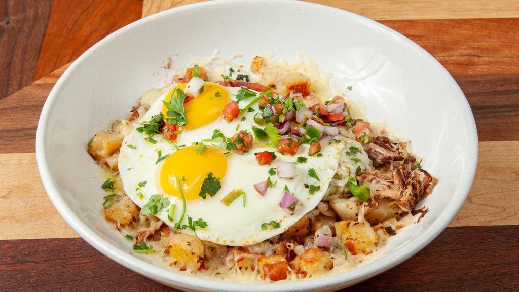 Salsa Verde Pork & Egg · Already a HomeGrown legend, When you mix rosemary potatoes with onion, slow roasted pork, jack cheese, salsa verde, two eggs of your choice, and pico de gallo.... you've pretty much had the best meal of your life.