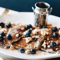Blueberry Streusel · Loaded with so many blueberries, they are actually Blue!  Three pancakes topped with fresh b...
