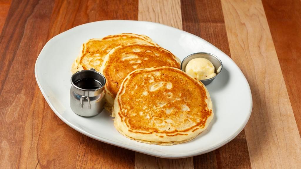 Classic Buttermilk Pancakes · Stay with the classic that put pancakes on the map.  Two buttermilk pancakes served with butter and syrup.