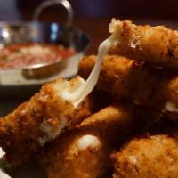 Mozzarella Sticks · Hand cut mozzarella battered and coated in herb breadcrumbs and fried golden brown served wi...