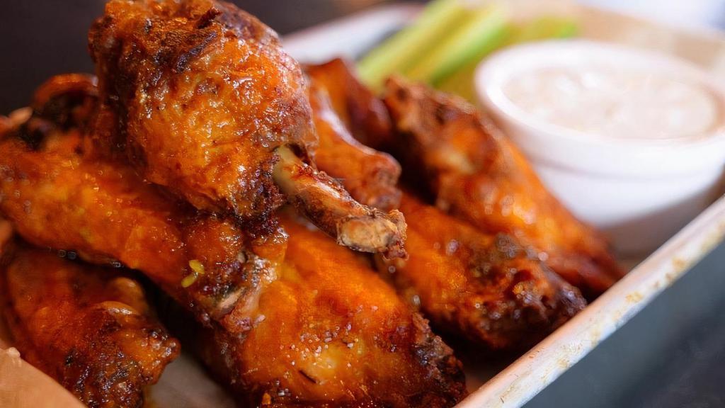 Fresh Hot Wings · 1 pound of fresh wings, covered in a chili powder rub, fried with housemade hot sauce served with bleu cheese dressing.