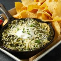 Spinach & Artichoke Dip · A delicious blend of spinach, artichokes, garlic, Monterey Jack, Romano and Parmesan cheeses...