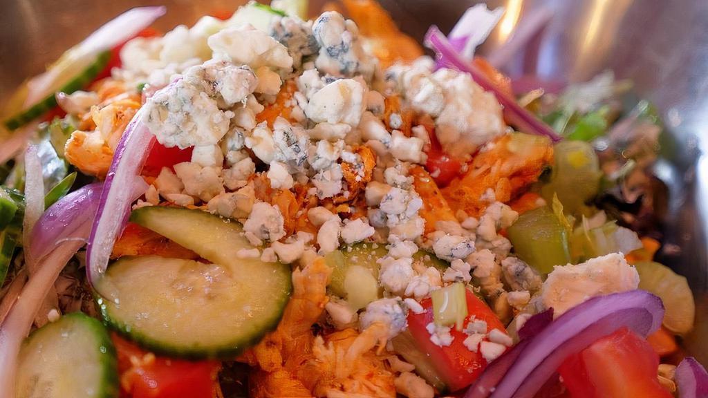 Roasted Chicken Salad · Hand-pulled chicken breast, spring mix, red onion, cucumbers, celery, tomatoes, granished with crumbled bleu cheese.  Served with your choice of homemade dressing