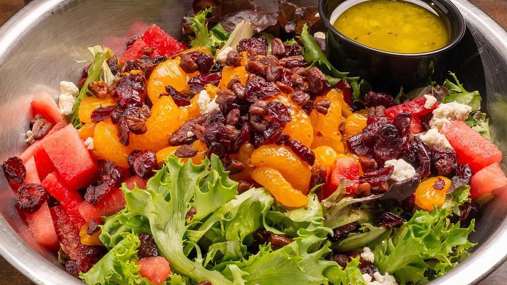 Citrus Watermelon Salad · Spring mix tossed in a homemade citrus vinaigrette with watermelon, oranges, dried cranberries, red onion, candied pecans and bleu cheese crumbles.