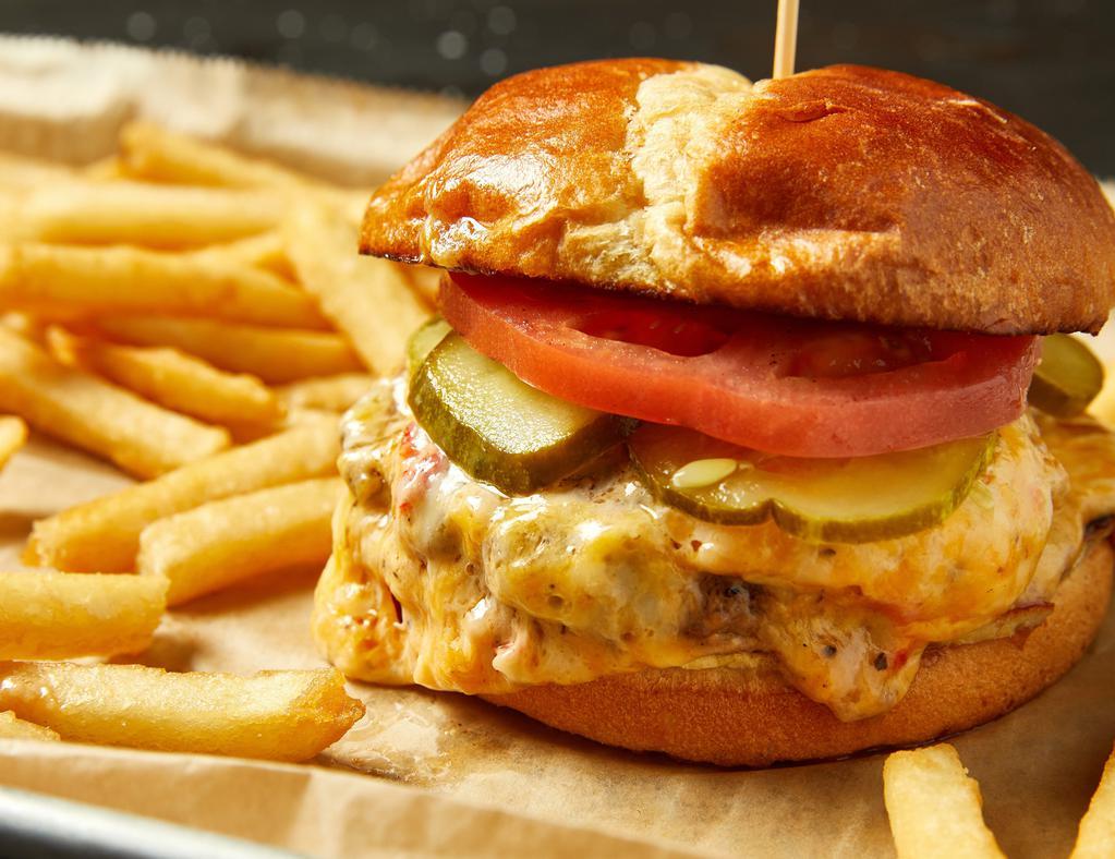 Pimento Cheese Burger · Two smash-cooked patties topped with classic pimento cheese, tomato and housemade B&B pickles served on butter-toasted bun.