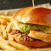 Lynne'S Chicken Sandwich · Blackened grilled chicken, caramelized onions, avocado mousse, Monterey jack cheese and smok...