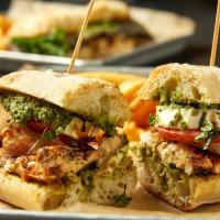 Chicken Caprese Sandwich · Fresh backed chicken served on a ciabatta roll with spinach and basil pesto, fresh mozzarell...