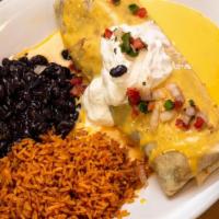Burrito · A giant four tortilla stuffed with your choice of brisket, chicken or ground beef; black bea...