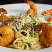 Bistro Shrimp · Crispy hand breaded shrimp, fresh mushrooms, tomato and spinach tossed with spaghetti and a ...